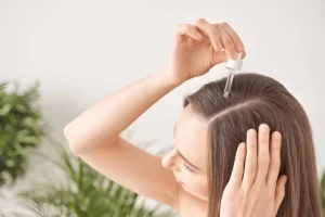 applying serum in hairs