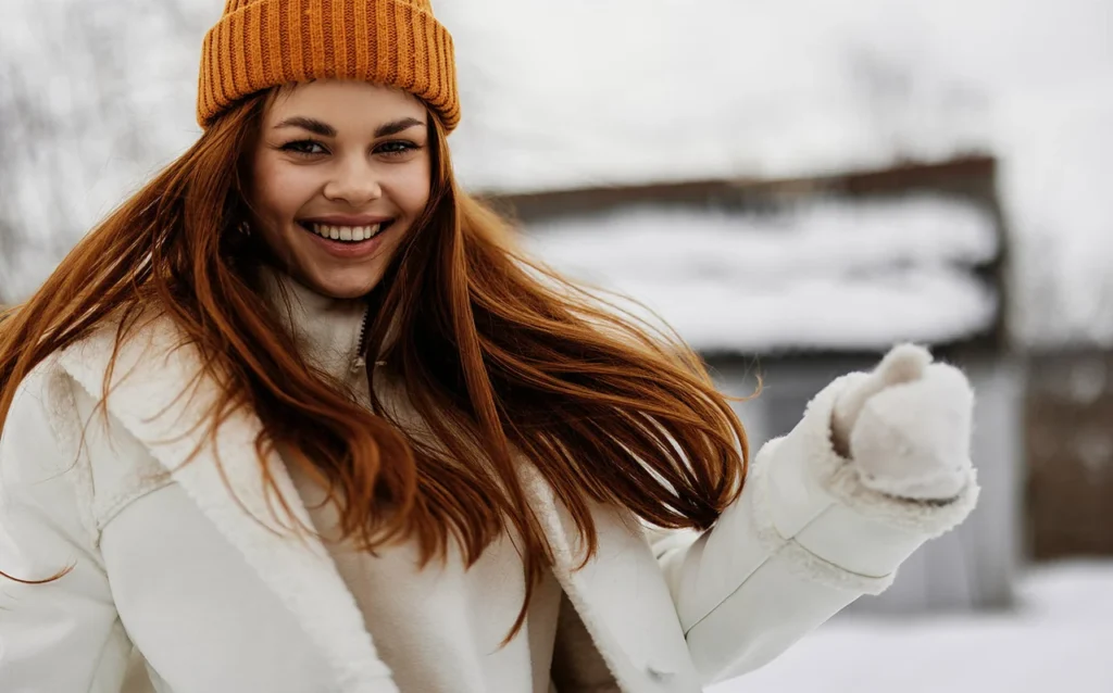 Woman with soft hair wearing a wool scarf in winter